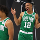 Grant Williams #12 of the Boston Celtics smiles behind Carsen Edwards #4 during Celtics Media Day at High Output Studios on September 30, 2019 in Canton, Massachusetts.